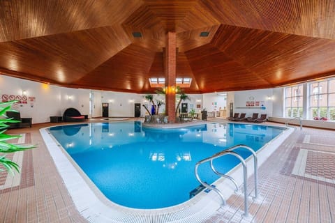 Dive into a spacious indoor pool designed for pure relaxation.