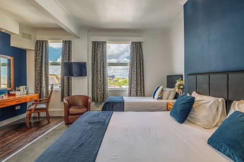 Unwind in crisp linens with bright views and calm tones.