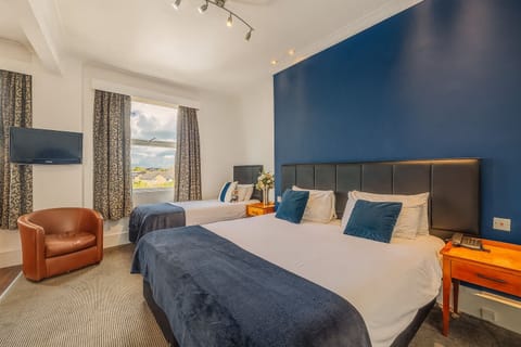Unwind in a bright room with plush beds and views