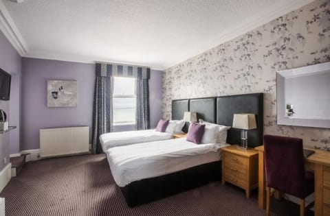 Stretch out on plush beds in a bright, calming room.