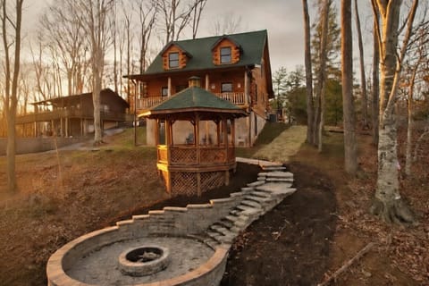 Incredible fire pit overlooking the lake. Pine Haven can deliver firewood for you!