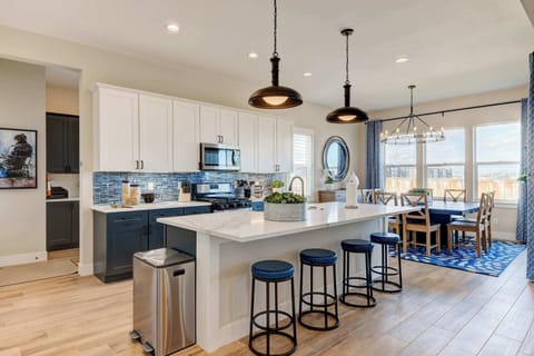 Kitchen: Cook in style with modern stainless steel appliances, chic cabinetry, and a beautiful backsplash that ties it all together.