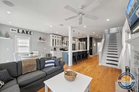 Bright and cozy living room with sectional and smart TV