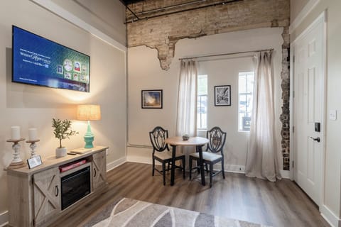 Cozy living space with natural light & a charming window nook — ideal for sipping coffee, journaling, or planning your Home Town adventures in Downtown Laurel. 