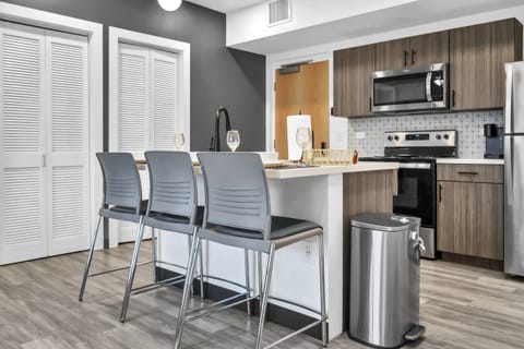 Kitchen area with all stainless steel appliances - microwave, Keurig pod coffee maker, dishwasher, range & refrigerator!