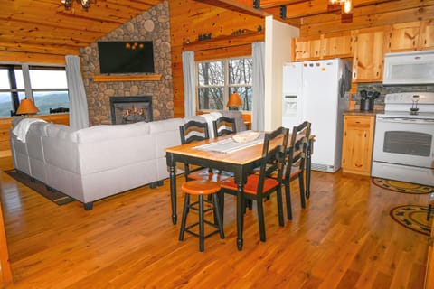 Comfy couch, gas log fireplace, smart tv and mountain views