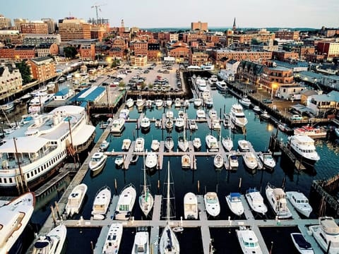 Soak in the vibrant harbor views with boats below.