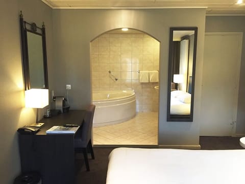 Unit with 1 King bed. Exact unit will be assigned upon arrival. Views, colors, and decor may vary.