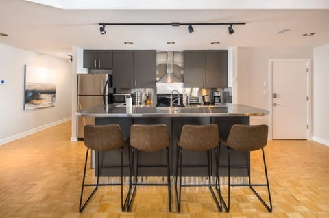 Fully equipped kitchen with bar seating.