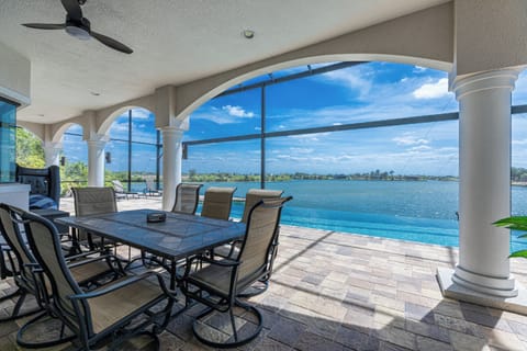 Shaded outdoor dining steps from the pool.

