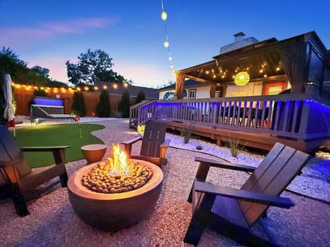 A tranquil backyard to unwind under the stars. The glow of the fire sets the perfect scene for conversations and storytelling. Melt away stress in the steamy hot tub as string lights twinkle overhead, making every evening feel magical and relaxed.