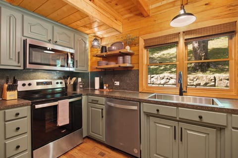 Full kitchen with pots/pans