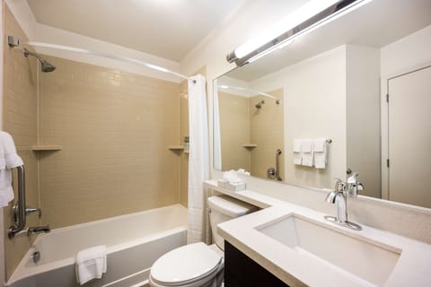 Full bathroom with a bath tub. Basic toiletries and towels are provided