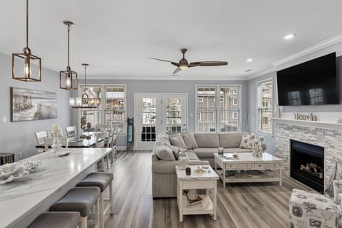 View of the living room, dining area and kitchen island
