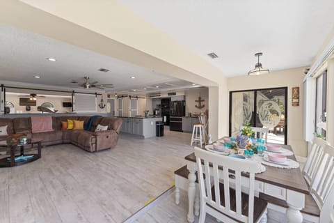 Living room to Dining room: Soft colors and comfy furniture invite you to unwind.