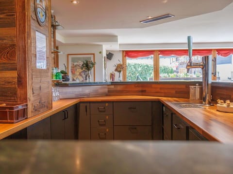 Wood, Interior Design, Flooring, Countertop, Kitchen, Cabinetry, Ceiling, Furniture, Floor, Lighting