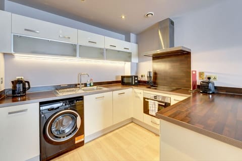 A fully stocked kitchen with all the essentials to cook and enjoy meals at home.