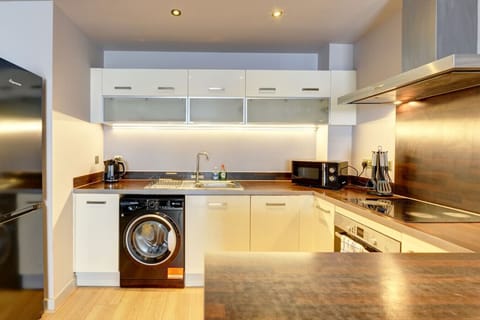 A fully stocked kitchen with all the essentials to cook and enjoy meals at home.
