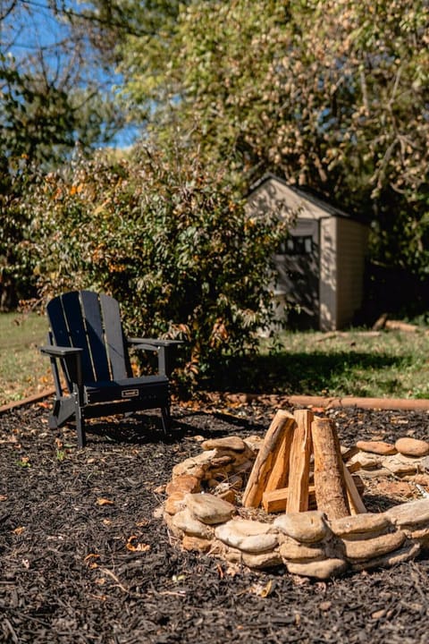 Firepit out back with Adirondack seating.