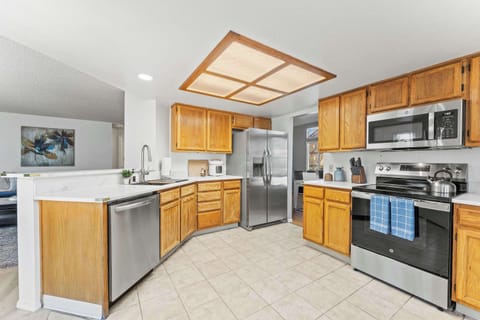 Cook, connect, and create memories in this bright and functional kitchen setup.