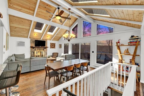 Bright Living Room with Large TV & Fireplace
