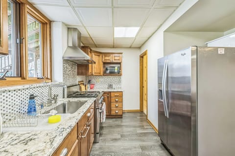 Sleek granite countertops and all the essentials to cook and serve a meal