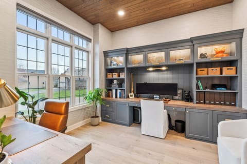 Double desk office with custom built in's and natural light. 