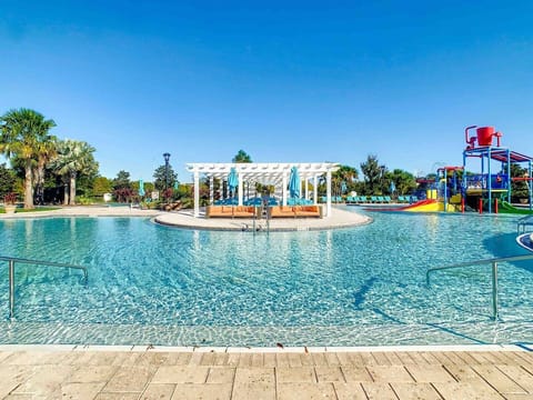 Dive into fun at the resort-style pool with splash zone and water slides!