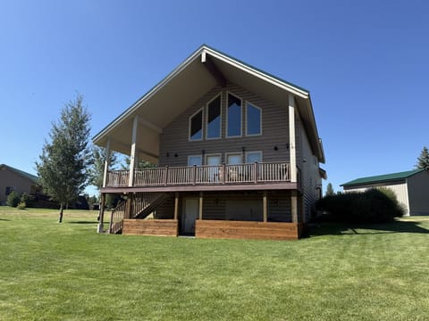Enjoy incredible mountain and golf course views from the back deck at Thundering Herd Lodge