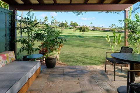 Sip morning coffee on the covered lanai overlooking greens.