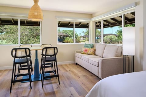 Lounge by wide windows and savor peaceful garden views.