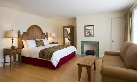 Relax in a roomy suite with fireplace charm and ocean light