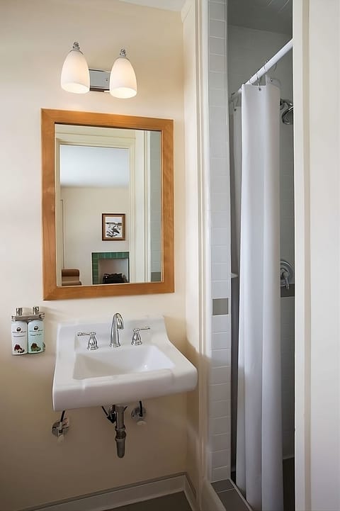 Refresh quickly with a bright vanity and clean shower stall.