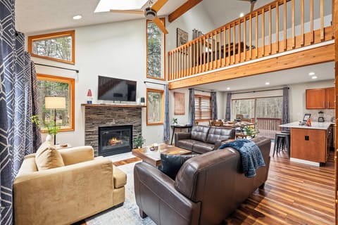 Soaring ceilings and cozy seating by the fireplace.