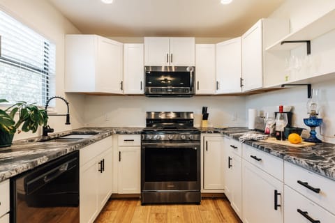 gourmet full kitchen with stove, oven, cooking materials