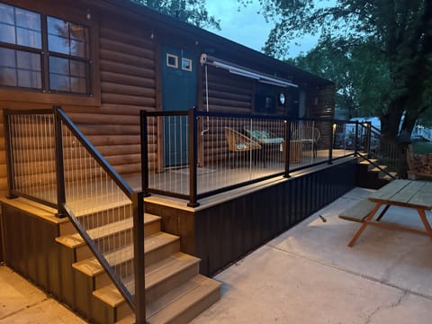 Cozy nighttime deck with lights highlighting pathways and seating areas for evening enjoyment.