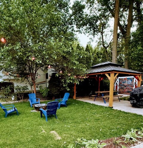 Cozy outdoor fire pit, perfect for evening gatherings, roasting marshmallows, or enjoying the campground ambiance.