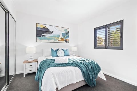 Retreat to a peaceful and well-appointed bedroom, designed for comfort and tranquility. 