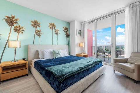 Experience luxury in our master bedroom with a king-sized bed and a connecting balcony offering stunning waterfront views.