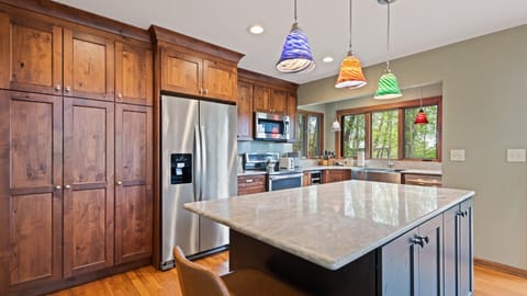 Cook up memories in this bright, spacious kitchen with colorful lighting.