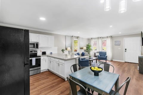 Dining table, kitchen, and living room