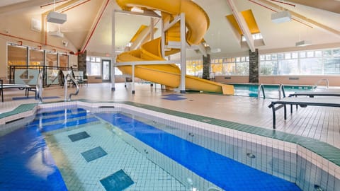 Enjoy the fantastic pool area with waterslide and hot tub!