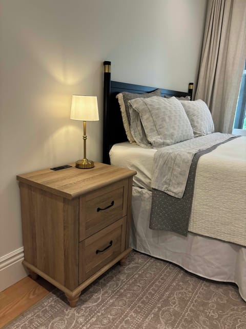 Qn bed w down duvet, nightstand w charging station custom blackout curtains
