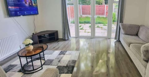 Comfortable living room with smart TV so you can catch up on your favourite shows after a day out in Manchester