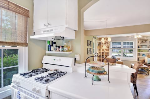 Kitchen With Gas Range and Open View - The kitchen at 204 Ashantilly Avenue offers a gas range, plenty of counter space, and a clear view into the dining and living areas—ideal for vacation cooking and connection.