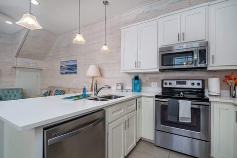 Fully equipped kitchen with spacious counter top perfect for meal preparations.