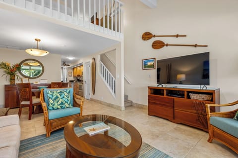 Relax in this inviting open-concept living space where tropical decor meets comfort. Your spacious retreat features island-inspired furnishings, vaulted ceilings, and plenty of room to unwind after exploring.