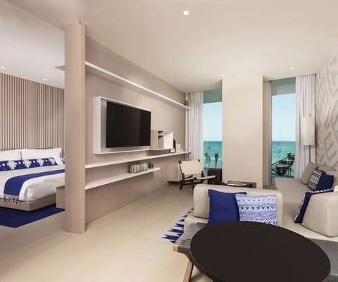 Relax together in the airy suite with ocean glimpses.