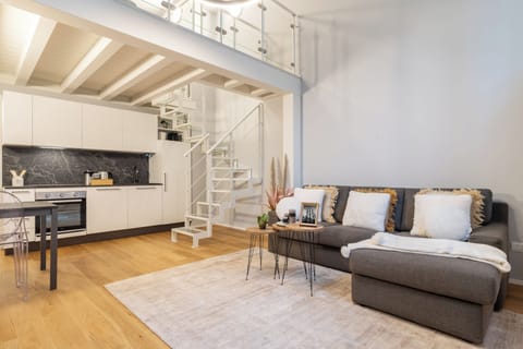 Living room (with AC, full kitchen, sofa-bed and access to first floor)