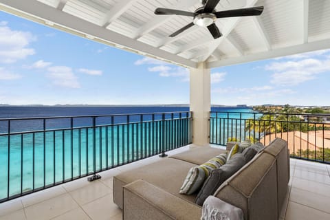 Top floor tranquility, steps from the sand


